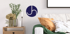 A couch and a table with a Janice Hall logo